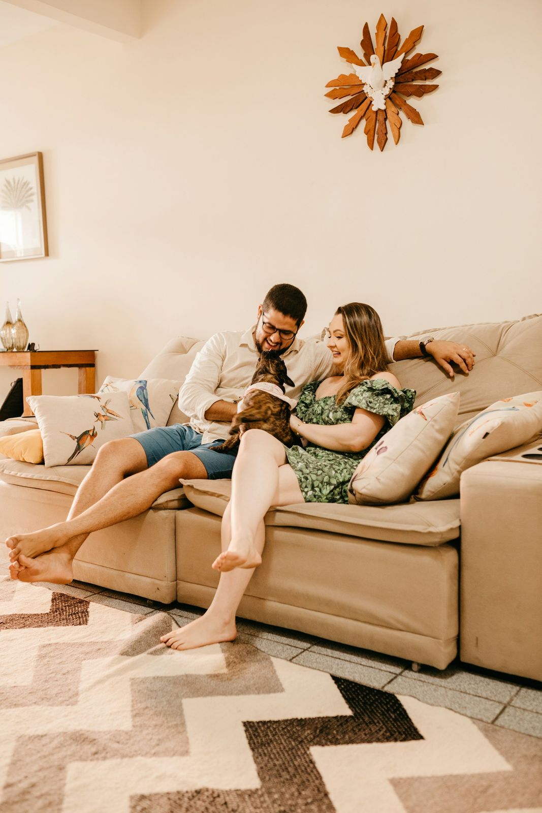 A couple relaxing together on a couch at home