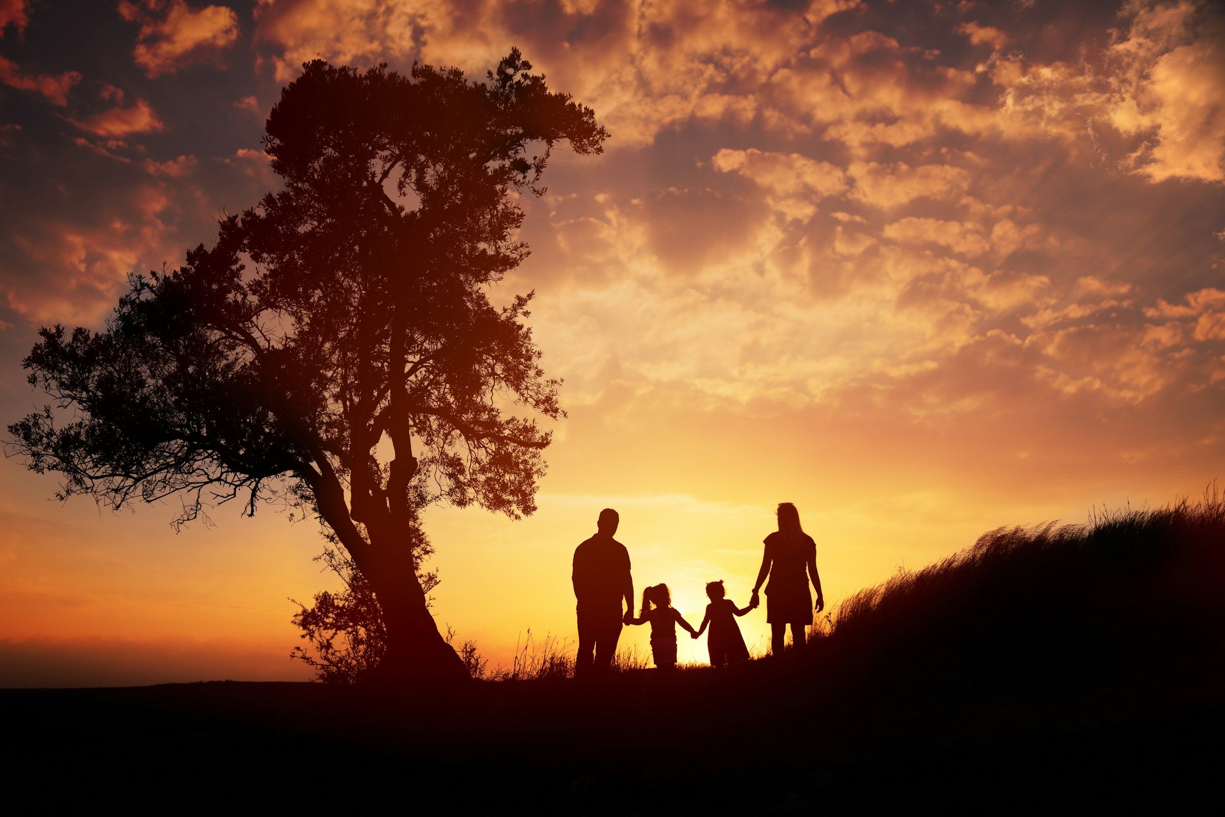 A family walking together at sunset